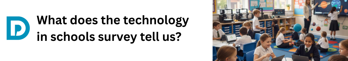  A group of primary school-aged children in uniform are engaged in a classroom setting featuring digital technology. In the foreground, two girls smile while working on laptops or tablets at a table. Other students are seated at desks with devices or gathered on a brightly colored rug. A teacher is visible near a large interactive screen displaying a science lesson on the solar system, with planets digitally overlaid onto the scene.