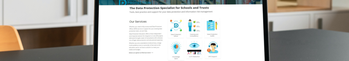 Laptop showing the Data Protection Education Knowledge Bank Home screen on a desk
